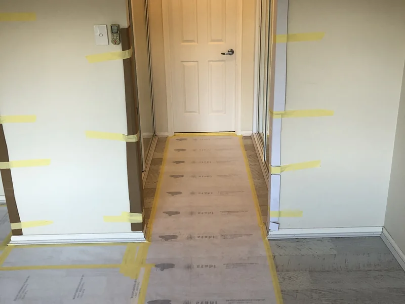 Cronulla master bedroom before flooring and window works, with surfaces protected