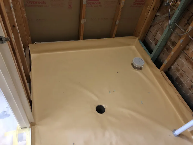 Downstairs powder room waterproofing during the Bateau Bay renovation