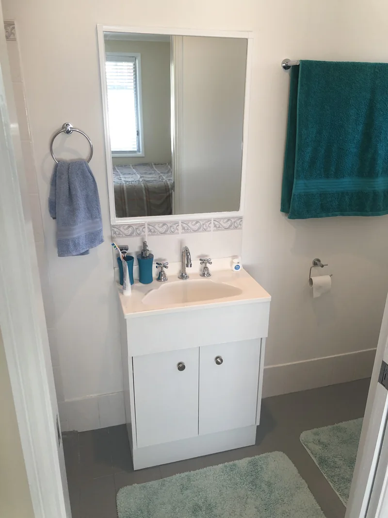 Main bathroom vanity before renovation in Castle Hill