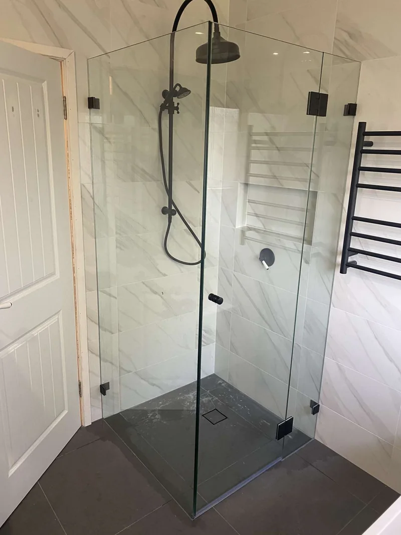 Frameless shower with black fittings after the Lisarow bathroom renovation