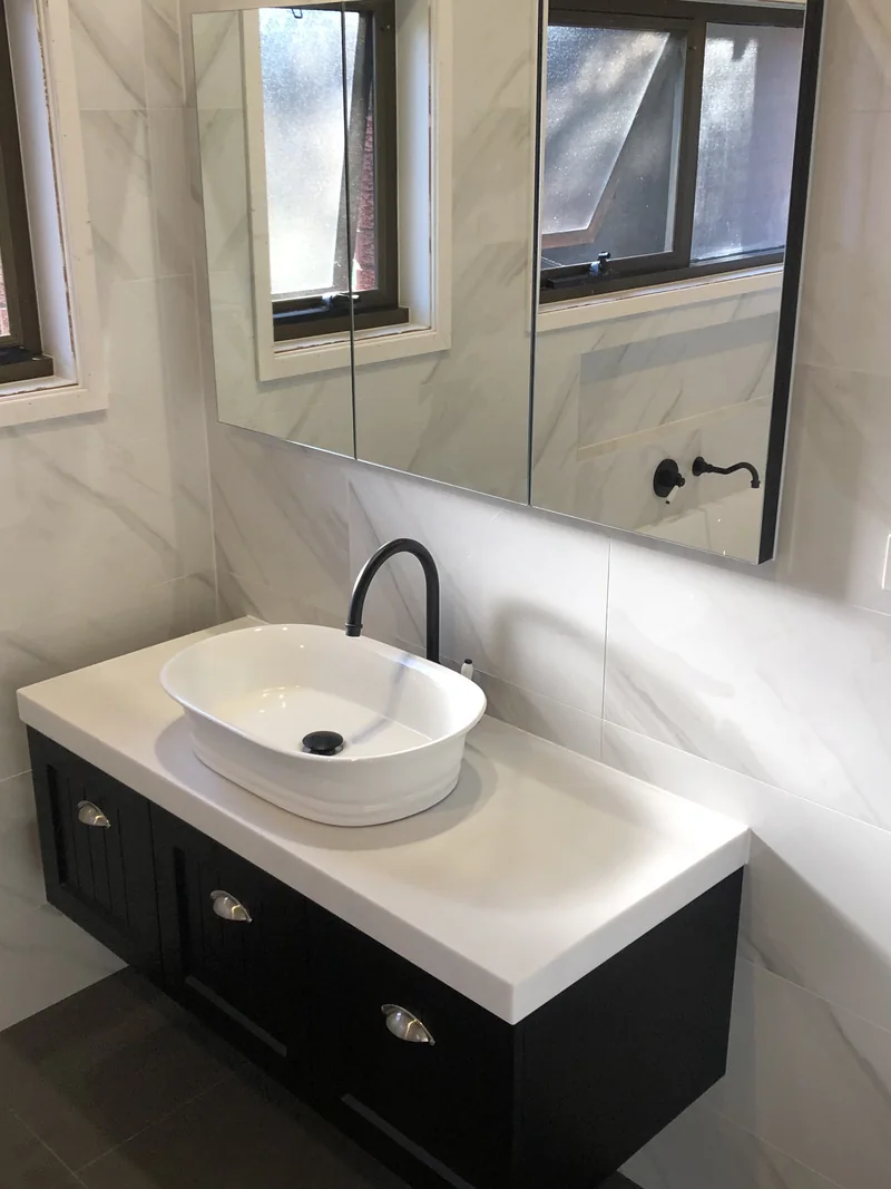 Wall-hung vanity and recessed mirrored cabinet after the Lisarow renovation