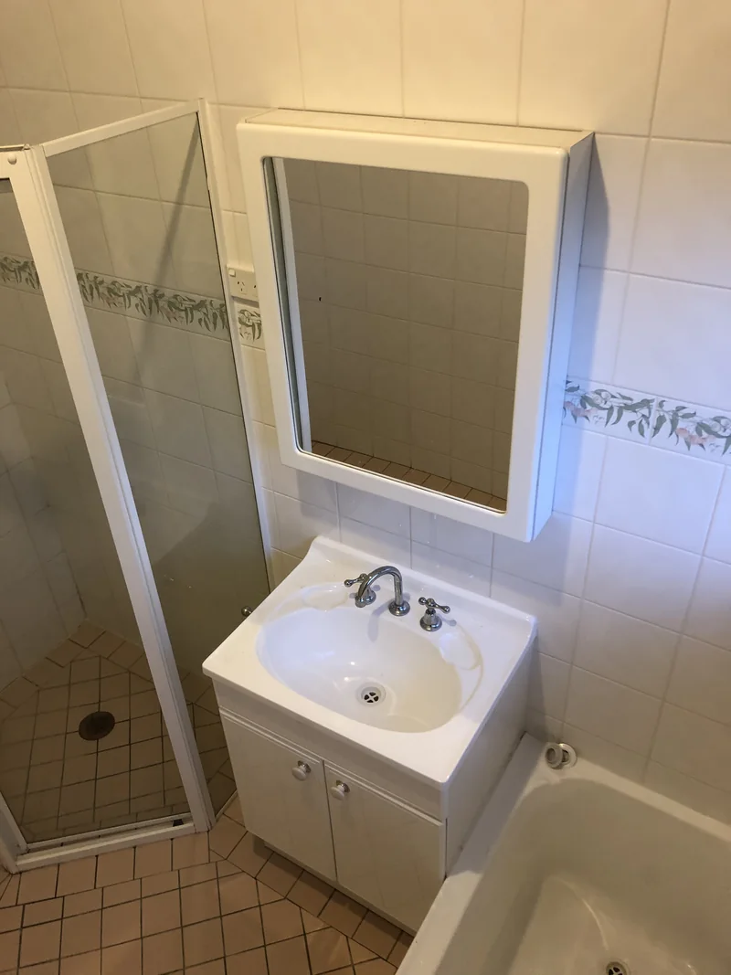 Floor-mounted vanity before the Lisarow bathroom renovation