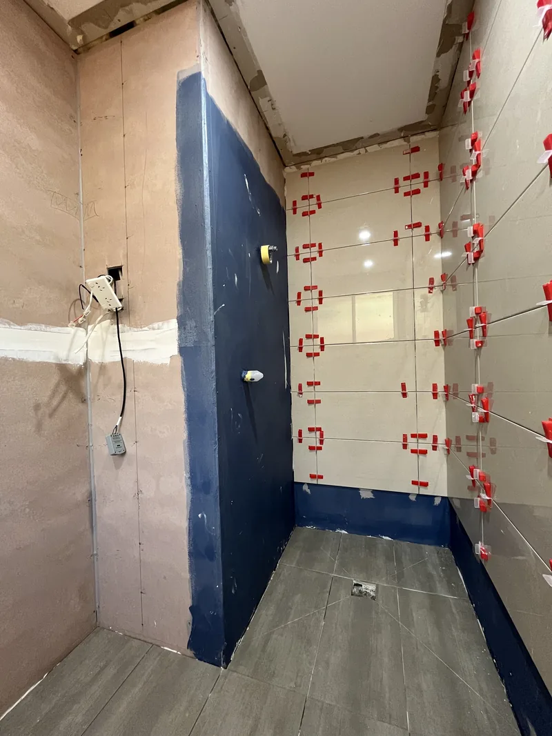 Wet-area membrane and wall tiling during the Mardi ensuite renovation