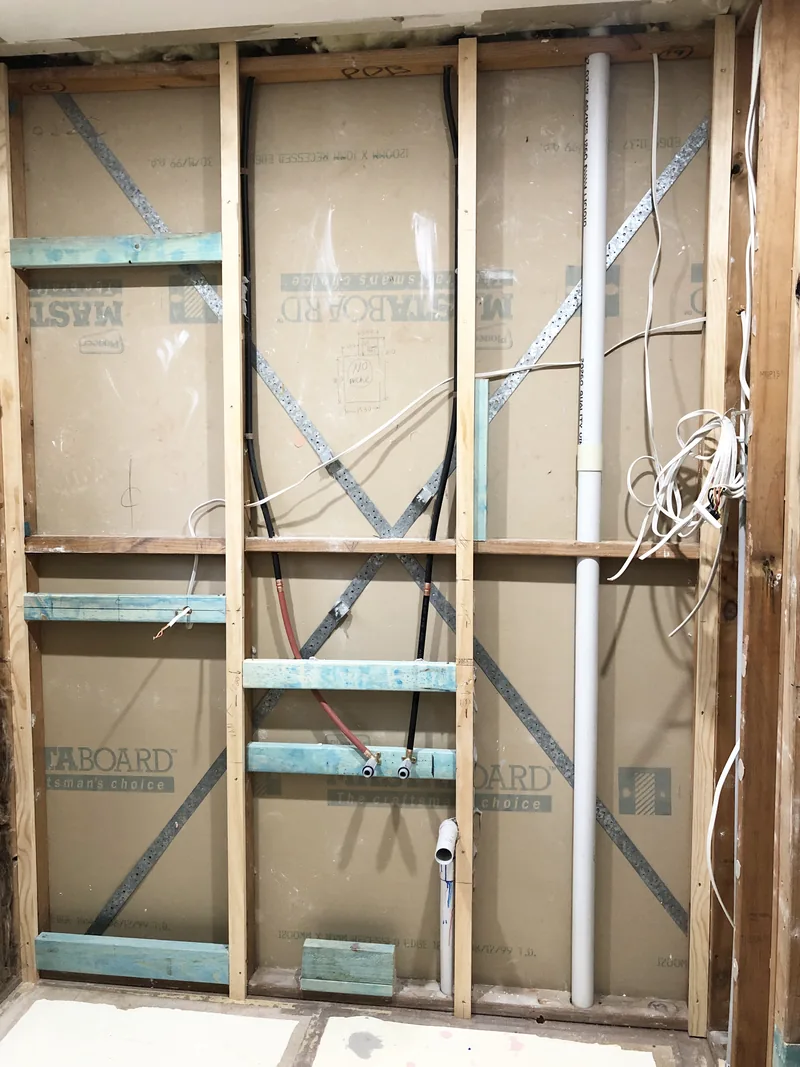 Open wall framing and new service positions during the Mardi ensuite renovation