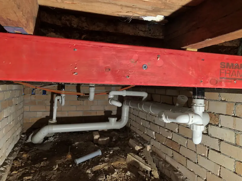 Underfloor plumbing during the North Gosford renovation