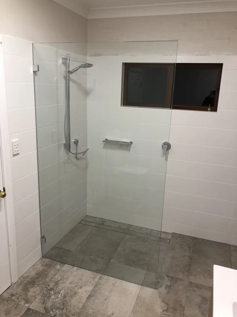 Open shower with fixed glass panel after the ensuite renovation in Terrigal