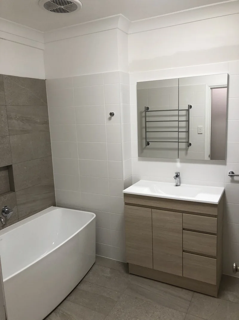 Main bathroom with separate bath and shower after renovation in Terrigal