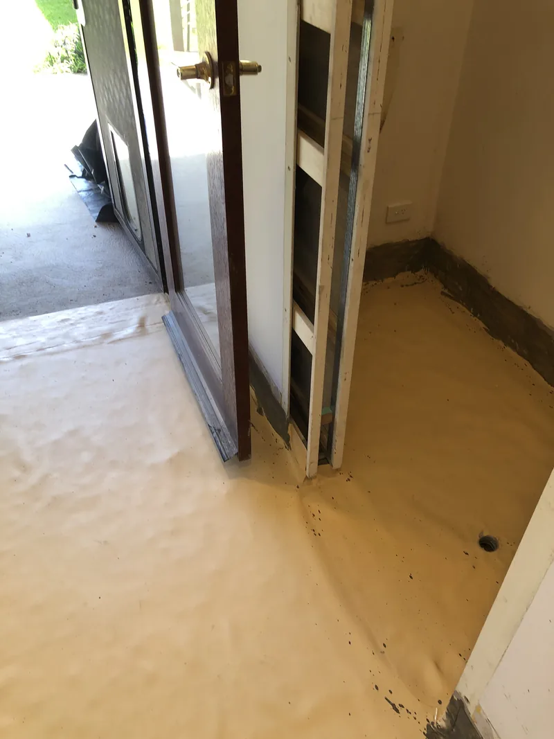 Cavity sliding door frame and wet-area floor membrane during the Umina renovation