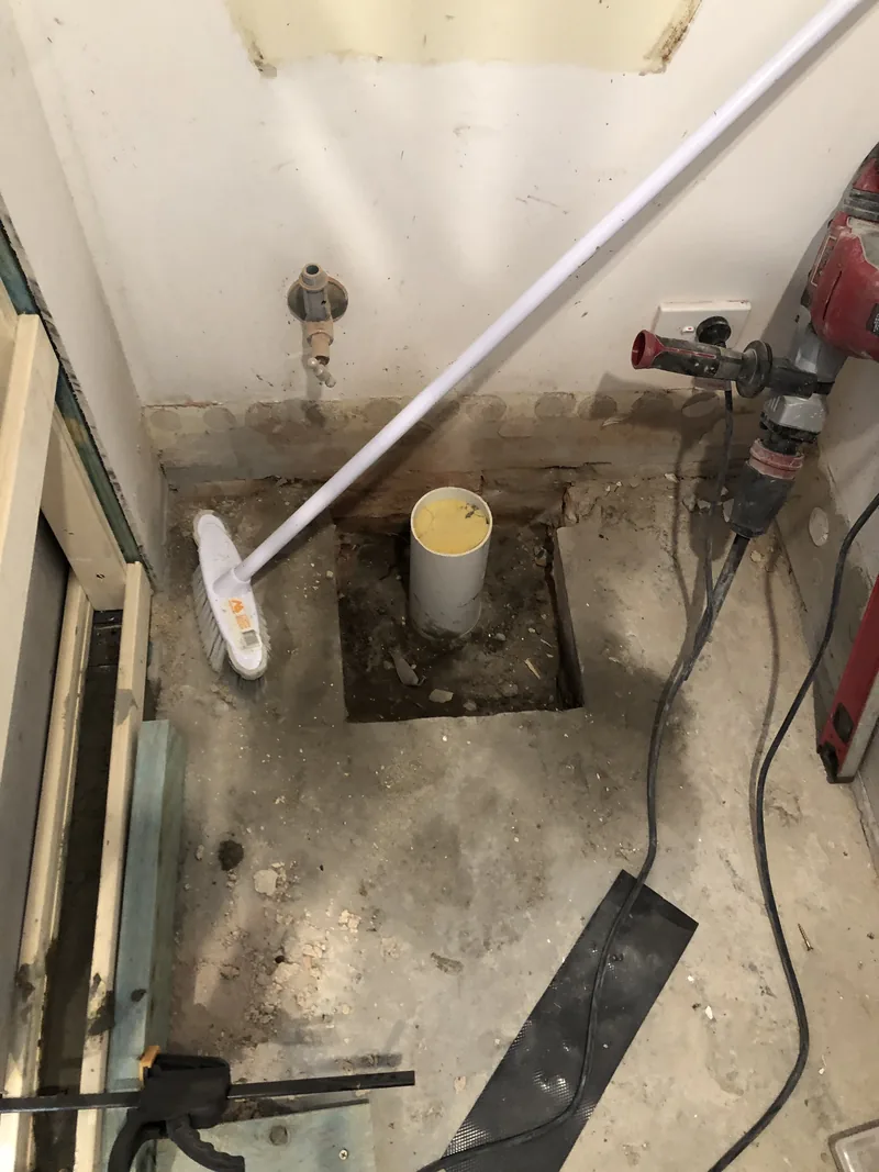 Floor opened for drainage relocation during the Umina renovation